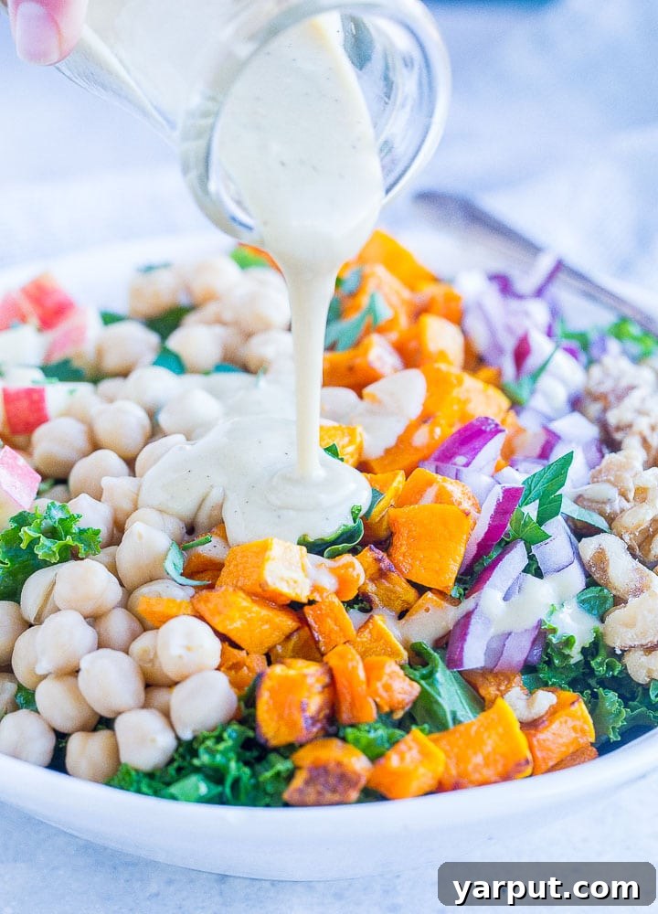 Autumn Abundance Salad 5 Close up of pouring creamy apple cider vinegar dressing on fall harvest salad