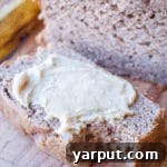 A perfectly baked slice of healthy banana bread, ready to be enjoyed.