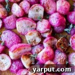 Oven-Roasted Radishes with Garlic and Fresh Herbs 6 Roasted radishes in a white bowl with fresh thyme