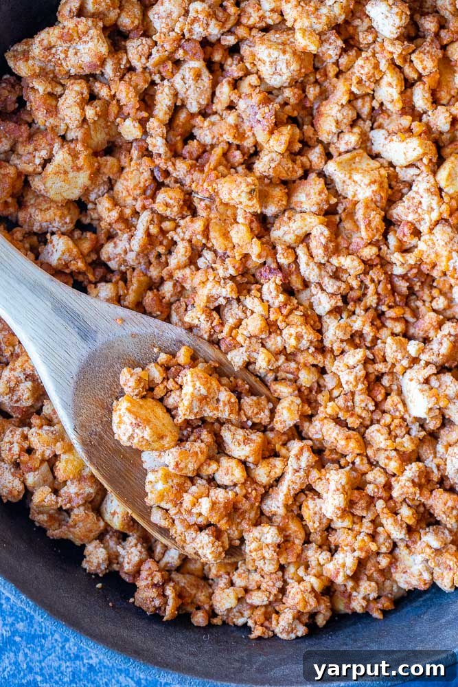 Savory Tofu Walnut Taco Crumble 5 A mouth-watering close-up of perfectly cooked vegan taco meat, featuring the irresistible combination of tofu and walnuts, ready to be incorporated into delicious meals.