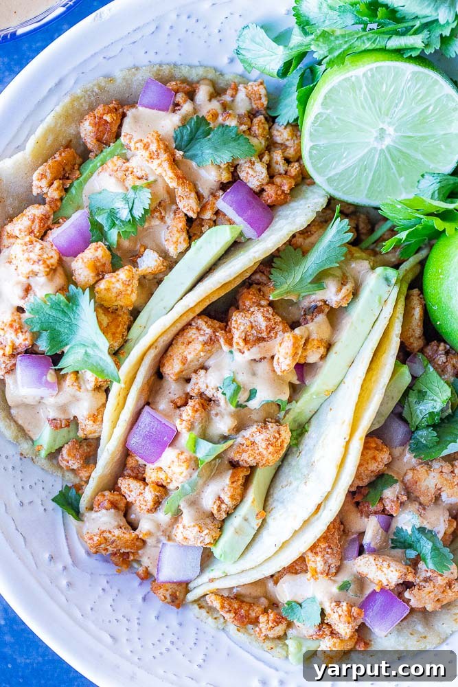 Savory Tofu Walnut Taco Crumble 6 Delicious vegan tofu tacos crafted with homemade vegan taco meat, served on soft tortillas with fresh toppings, embodying a healthy and flavorful plant-based meal.