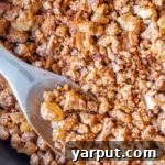 A top-down view of vegan taco meat with tofu and walnuts in a light pink bowl, ready for serving.