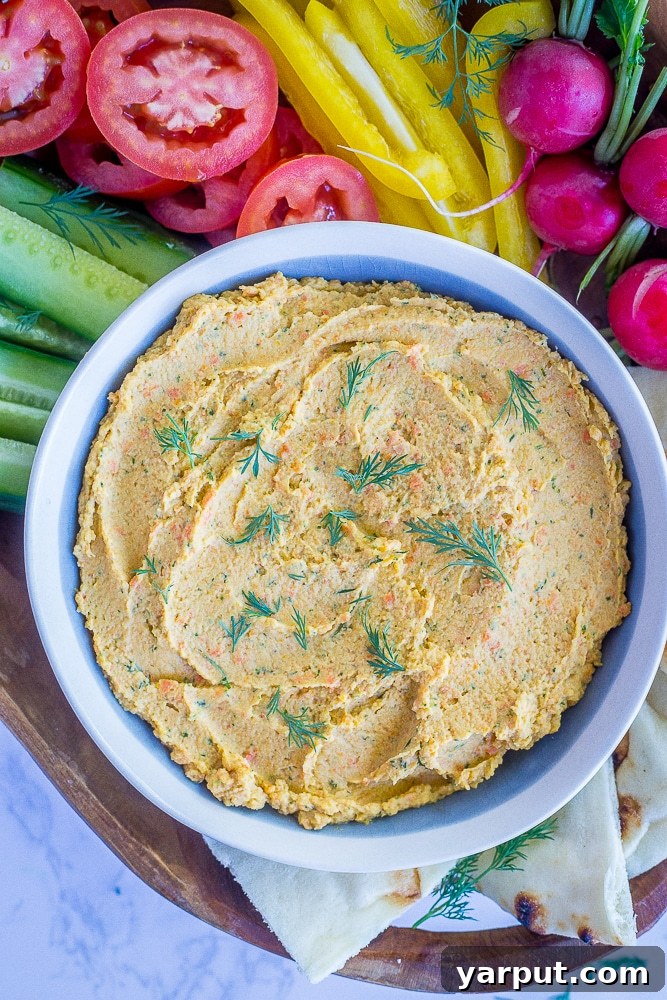 20 Satisfying Vegetarian Weight Watchers Recipes 4 Creamy Roasted Carrot and Dill Hummus, a healthy and flavorful dip. Perfect as a snack or appetizer, low in SmartPoints and full of nutritious vegetables.