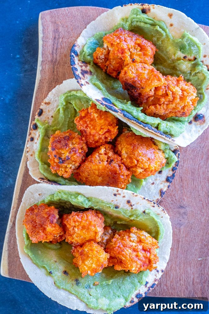 Buffalo Cauliflower Tacos with Creamy Ranch Slaw 4 Golden-brown Buffalo Cauliflower ready to be assembled into tacos