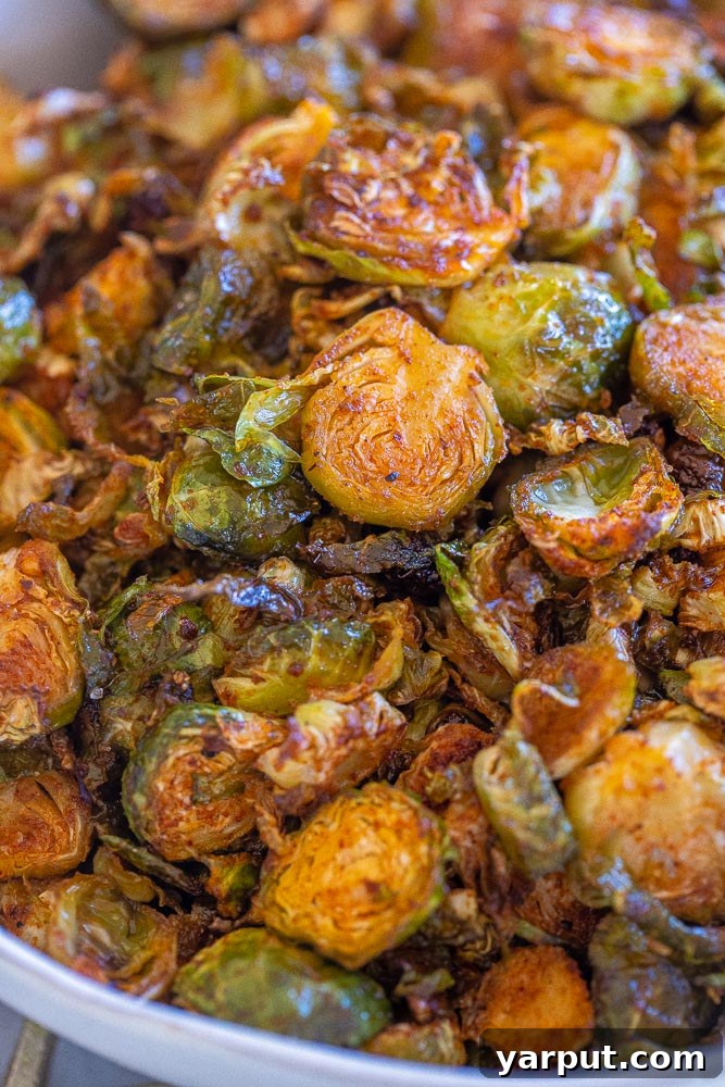 Smoky Charred Brussels Sprouts 6 Close up of roasted BBQ Brussels sprouts in a serving dish