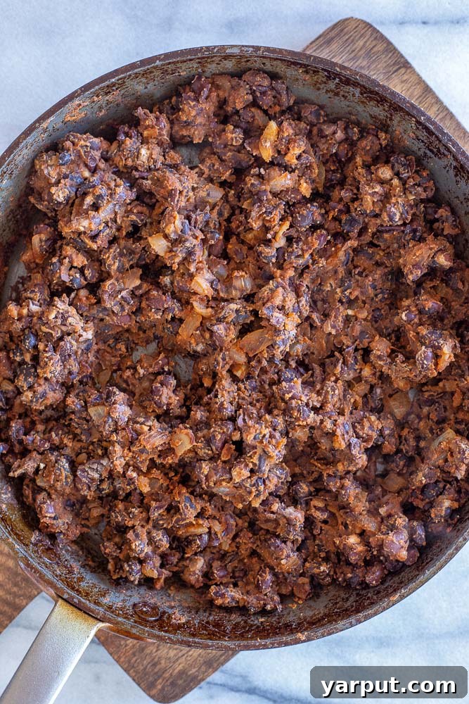 Effortless Vegan Black Bean Tacos 3 a close-up shot of a pan filled with the savory black bean taco mixture