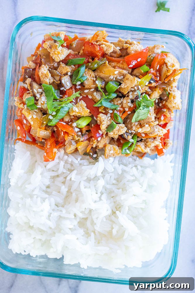 Korean Tofu & Veggie Power Bowls 6 A selection of Korean-inspired tofu bowls prepped for the week, showcasing perfectly portioned meals with tofu, vegetables, and rice in containers.
