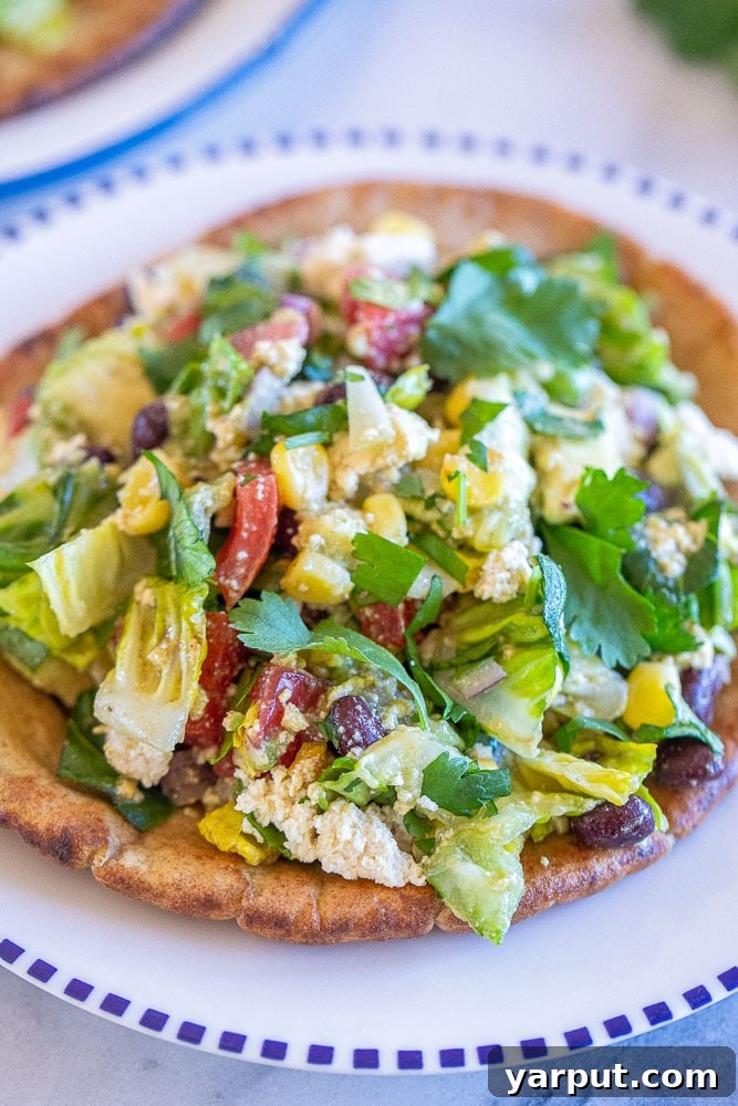 Southwest Salad Pockets 5 Close-up of a filled vegan chopped salad pita, showing the vibrant ingredients