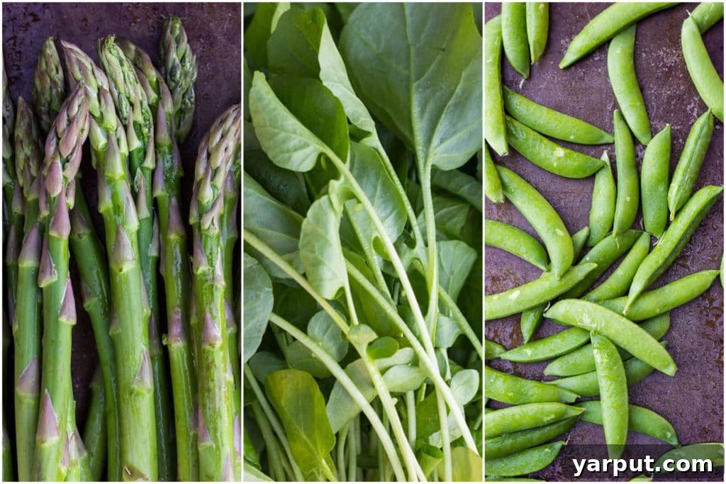 Close-up shot of fresh spring vegetables laid out, including vibrant green asparagus spears, a pile of delicate watercress leaves, and crisp sugar snap peas, ready for preparation.