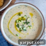 A small image of the creamy vegan tzatziki sauce in a bowl, used in the recipe card header.