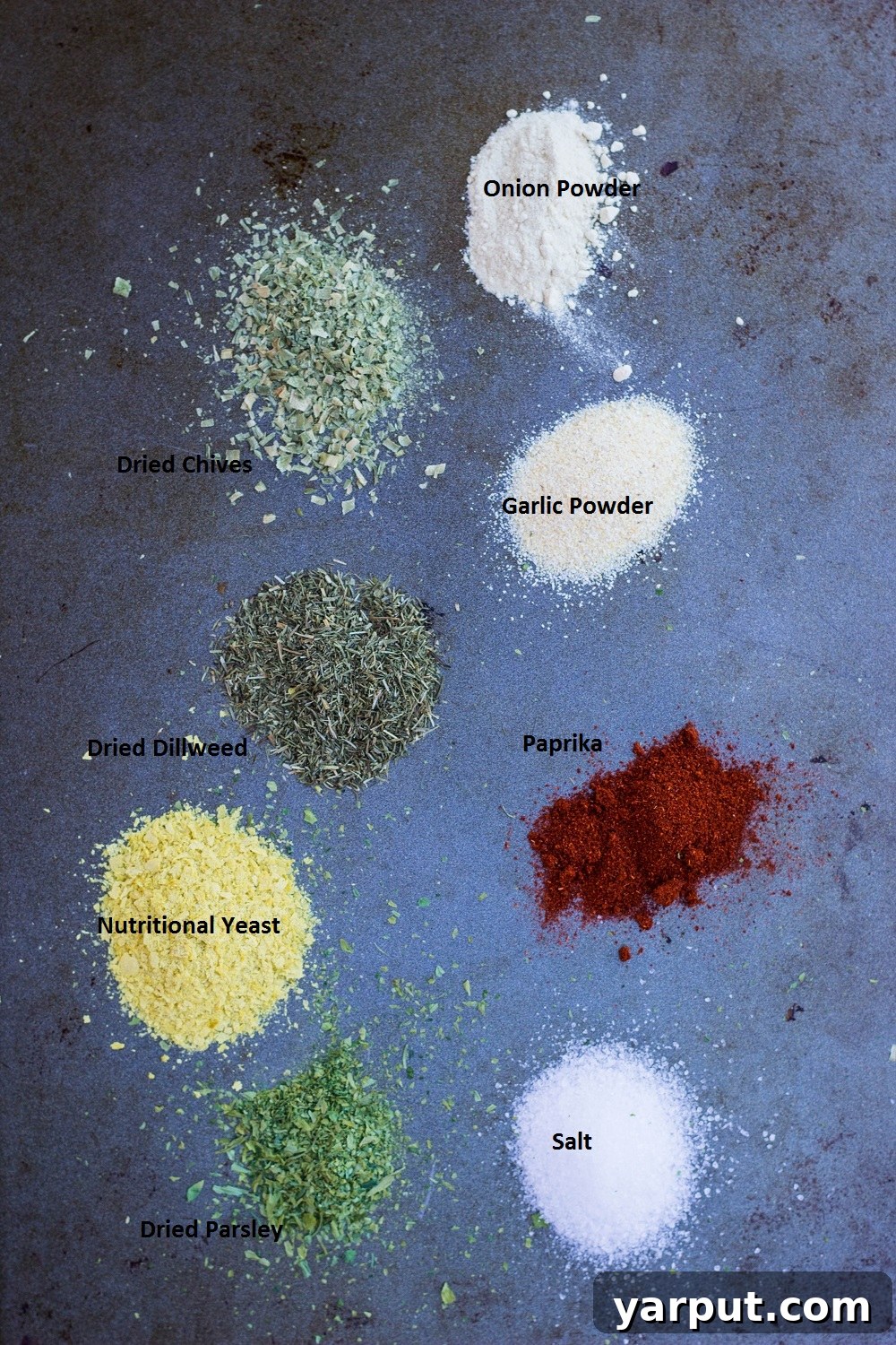 A selection of vibrant spices laid out, showcasing the key ingredients like paprika, onion powder, garlic powder, dried chives, dill, and parsley, essential for the signature Cool Ranch flavor profile.