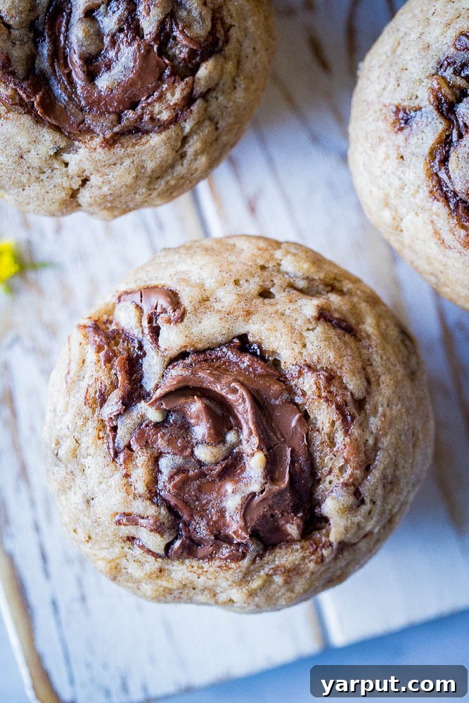 Nutella Marbled Banana Muffins 5 A mesmerizing close-up of a Nutella swirl, showcasing the beautiful marbling within the banana muffin.