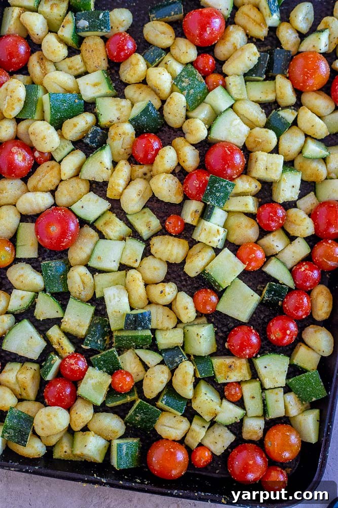 Golden Gnocchi with Roasted Zucchini and Burst Tomatoes 4 sheet pan gnocchi before it's been put in the oven