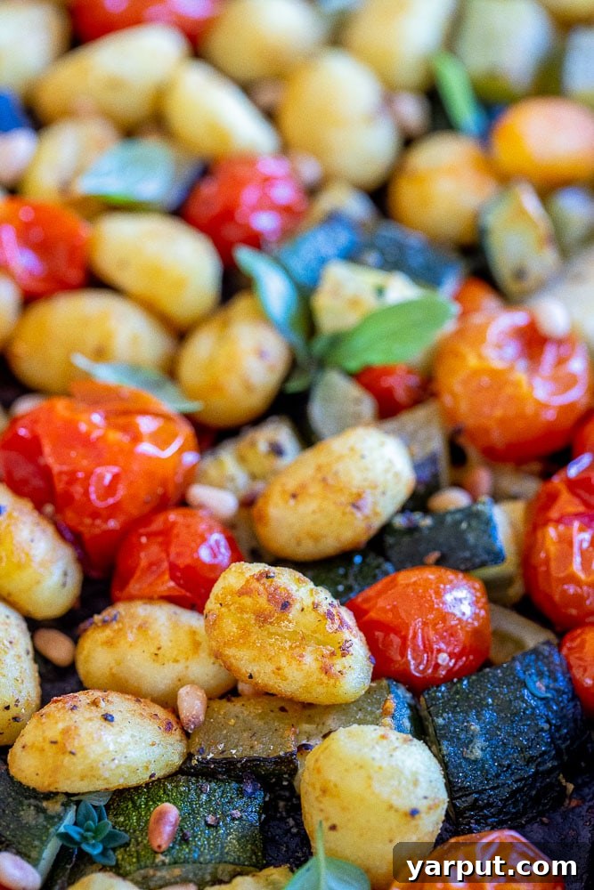 Golden Gnocchi with Roasted Zucchini and Burst Tomatoes 5 close up of crispy gnocchi baked on a sheet pan
