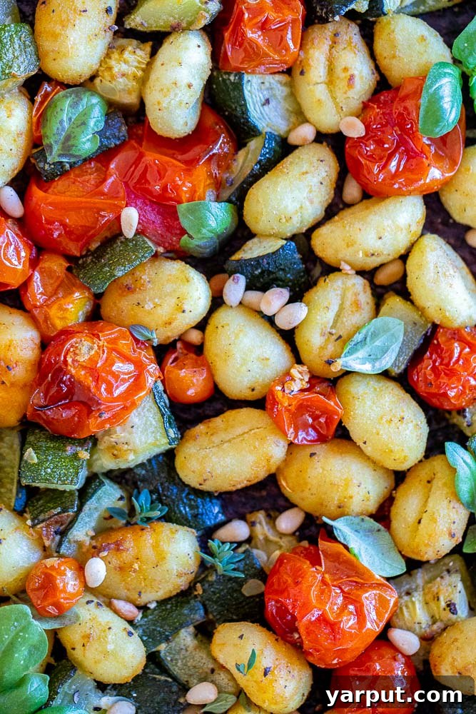 Golden Gnocchi with Roasted Zucchini and Burst Tomatoes 6 close up of sheet pan gnocchi with zucchini and cherry tomatoes