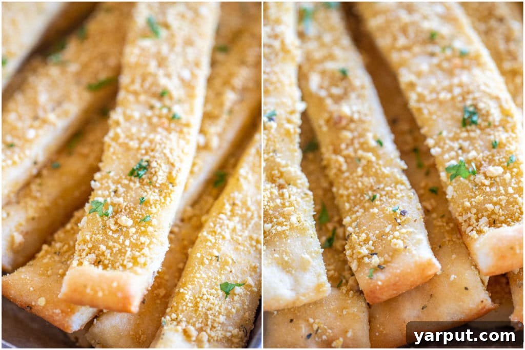 Irresistible Vegan Breadsticks 6 Close-up shots of warm vegan breadsticks generously sprinkled with vegan parmesan cheese, ready to be served.