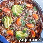 A vibrant bowl of Pumpkin Skillet Enchiladas