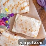 Homemade Cinnamon Sugar Pop-Tarts on a cutting board