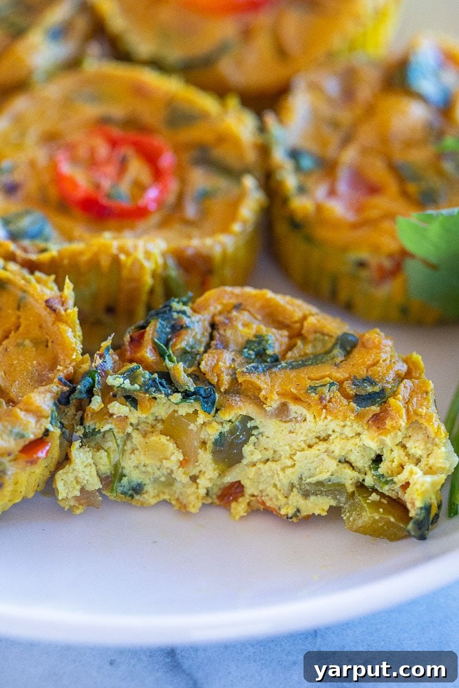 Plant-Based Egg Bites 6 Vegan egg cup with a bite taken out of it