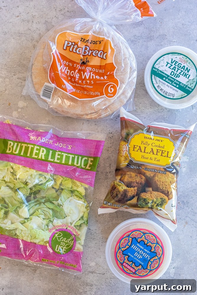 Loaded Vegan Falafel Pitas 3 All five ingredients needed to make the easy vegan falafel pitas from Trader Joe's: pita bread, hummus, falafel, lettuce, and vegan tzatziki sauce