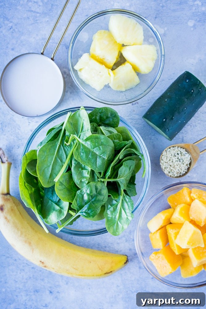 Delicious and Nutritious Green Smoothie for Kids 3 green smoothie recipe ingredients laid out, highlighting fresh produce for a healthy blend