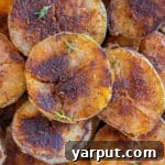 Close up of a blackened potato, showing the rich seasoning.