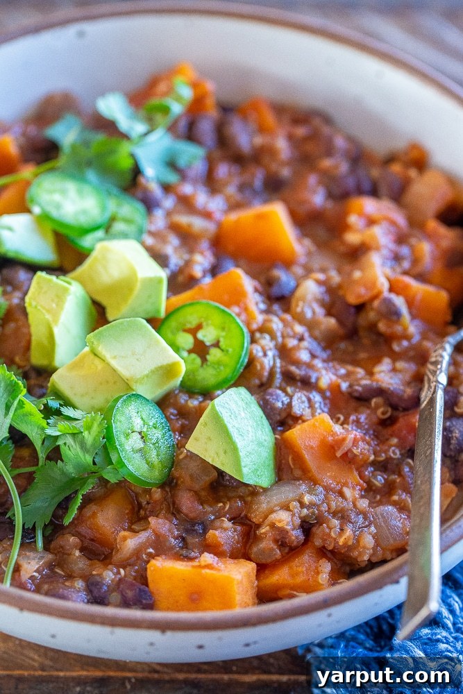 Wholesome Sweet Potato Quinoa Chili 5 close up of sweet potato and quinoa chili in a bowl with avocado