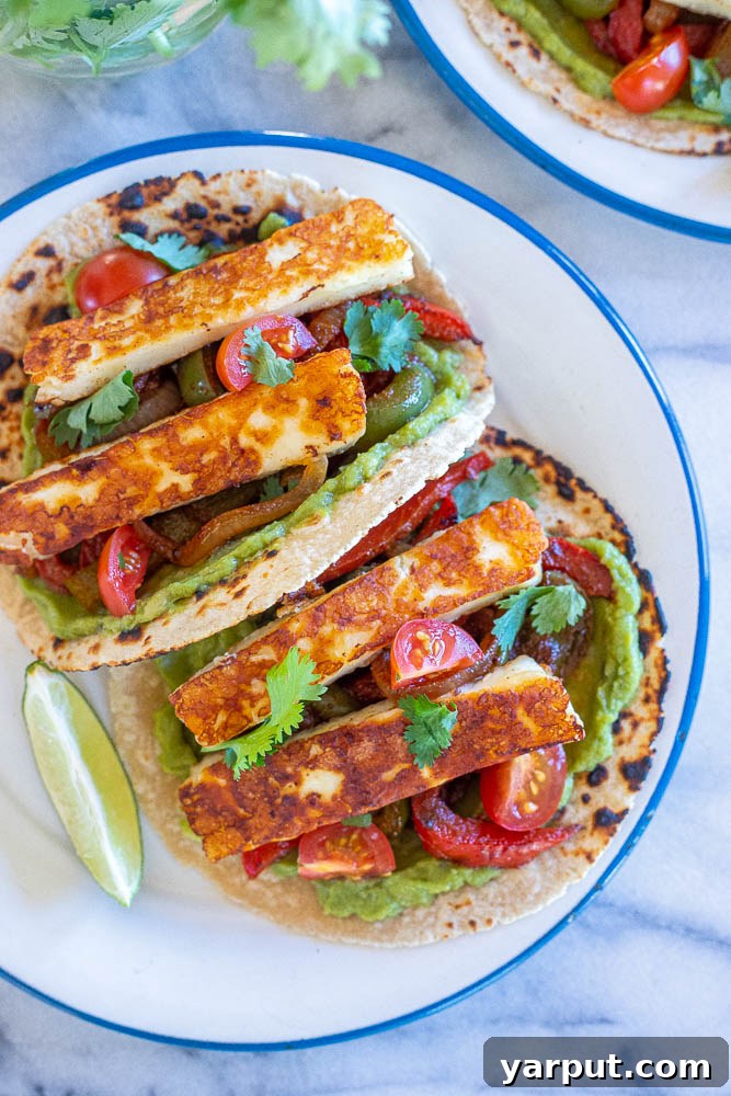 Vegetarian Fajitas with Halloumi, a sizzling and cheesy meatless fajita option served with bell peppers and onions.