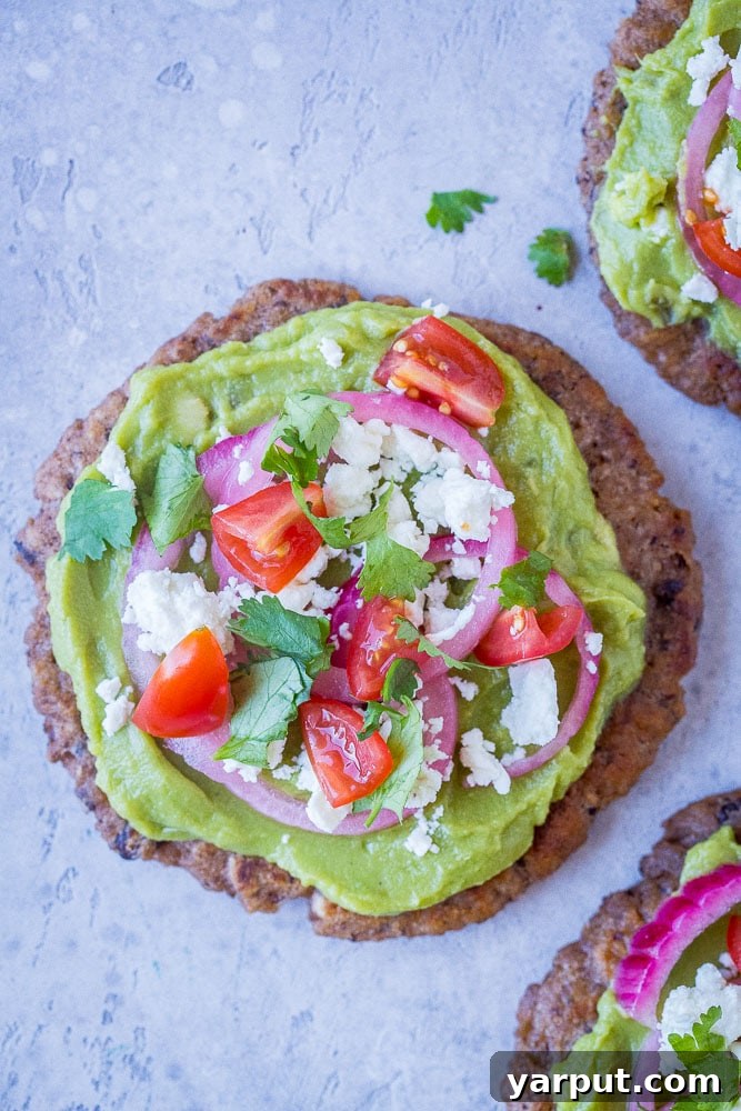 Guacamole Tostadas with Black Bean Tortillas, a fresh and wholesome tostada recipe with vibrant green guacamole.