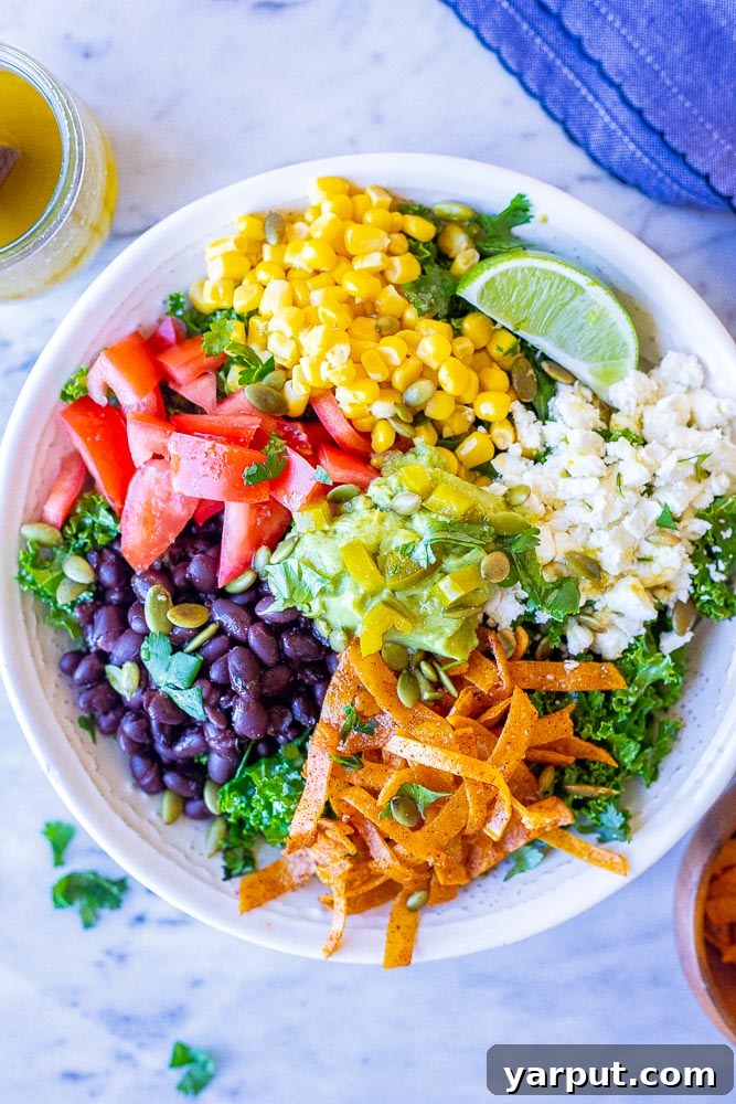 Mexican Kale Salad with Cumin Lime Dressing, a healthy and zesty side or light meal with colorful vegetables.