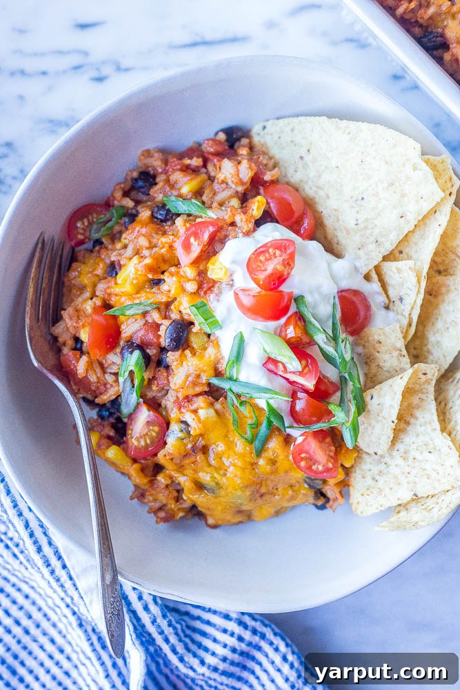 Cheesy Rice Enchilada Casserole, a comforting and easy one-dish meal baked to golden perfection.