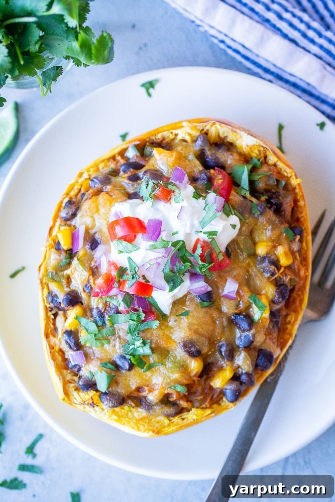 Spaghetti Squash Enchilada Boats, a healthy and creative take on enchiladas, filled with a rich mixture.