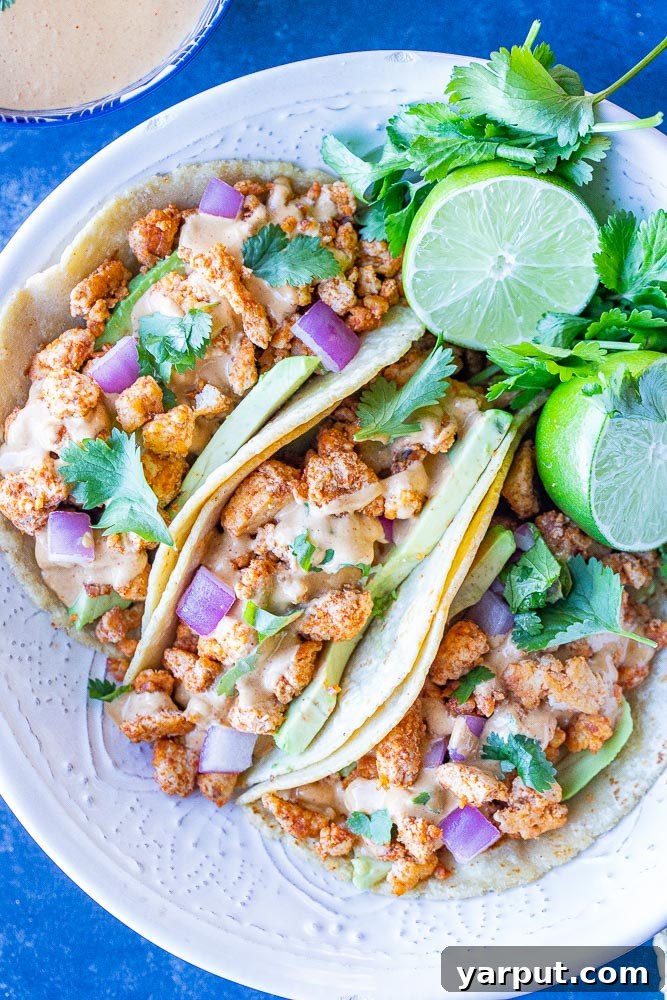 Vegan Tacos with Tahini Cheese Sauce, a creamy and dairy-free taco option with fresh toppings like cilantro and radishes.
