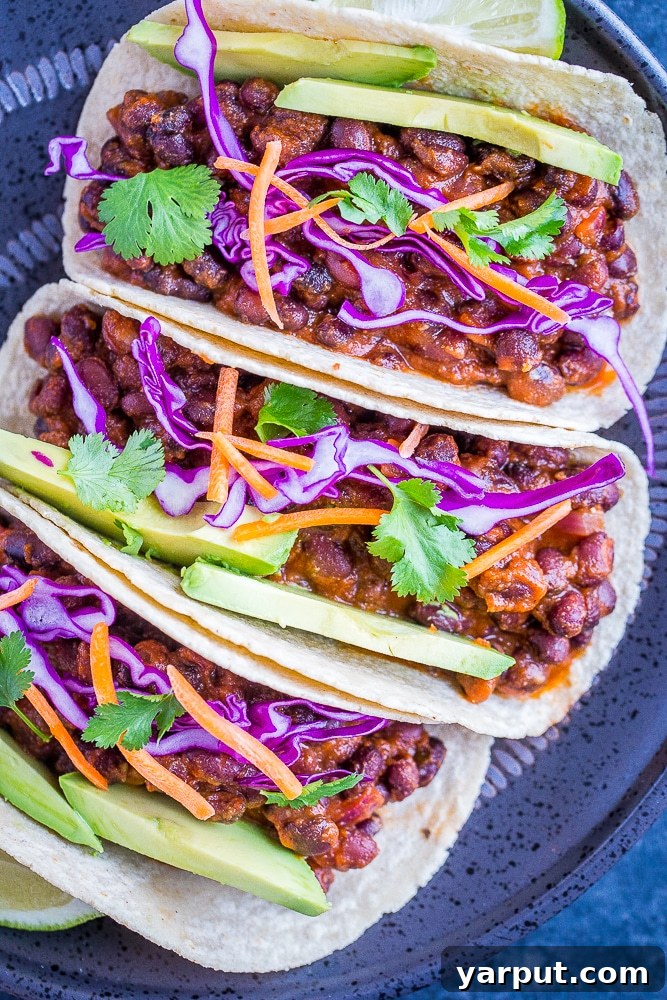 20 Minute BBQ Black Bean Tacos, a quick and easy weeknight vegetarian dinner, topped with creamy slaw.