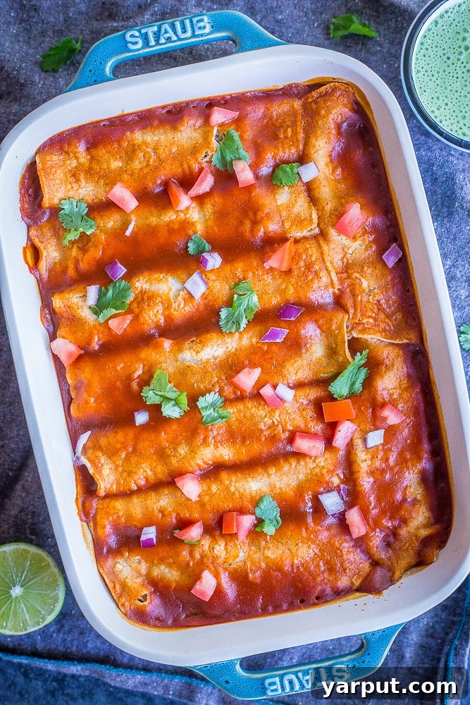 Easy Spaghetti Squash and Black Bean Enchiladas, a lighter twist on a classic, baked in a casserole dish.