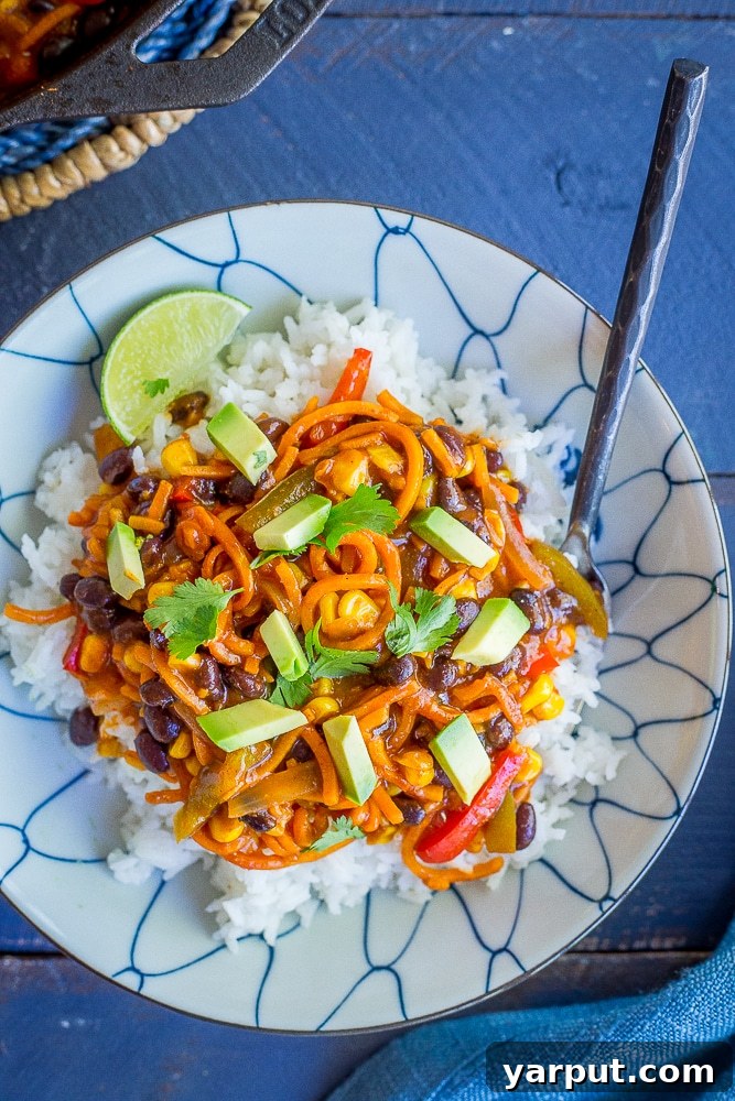 Spiralized Sweet Potato Enchilada Bowls, a healthy and creative low-carb enchilada alternative, filled with a colorful mix.