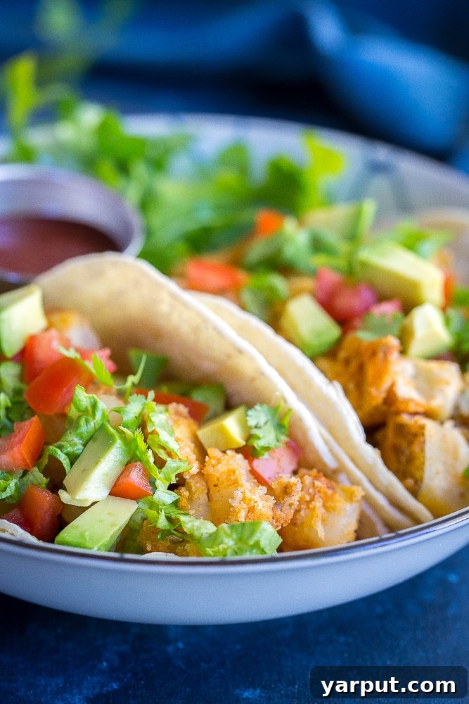 Crispy Potato Tacos, a simple yet incredibly satisfying vegetarian taco recipe, golden brown and crunchy.