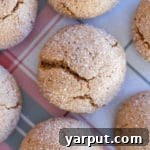 Close up of a thick and chewy maple cookie, suggesting the richness of the recipe.