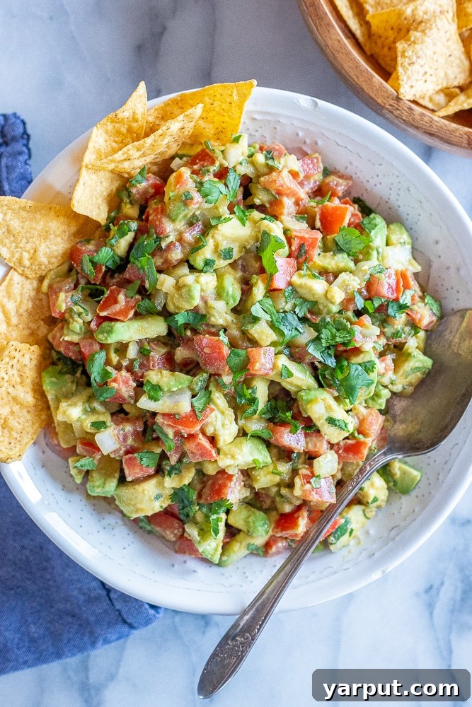 Hearty Avocado Salsa 2 chunky avocado salsa in a bowl with chips