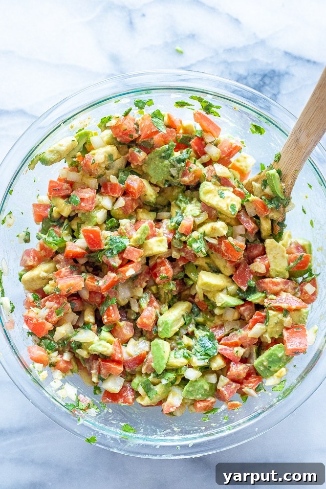 Hearty Avocado Salsa 5 chunky avocado salsa in a bowl mixed up
