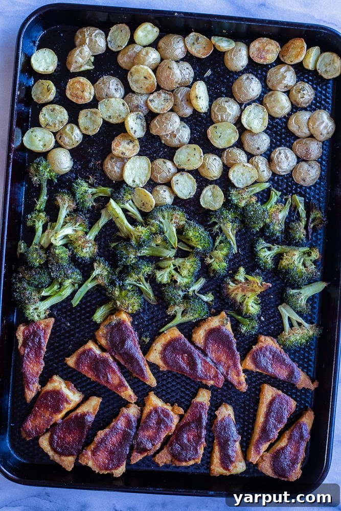 One-Pan BBQ Tofu Power Plate 2 sheet pan bbq tofu with potatoes and broccoli out of the oven, freshly cooked