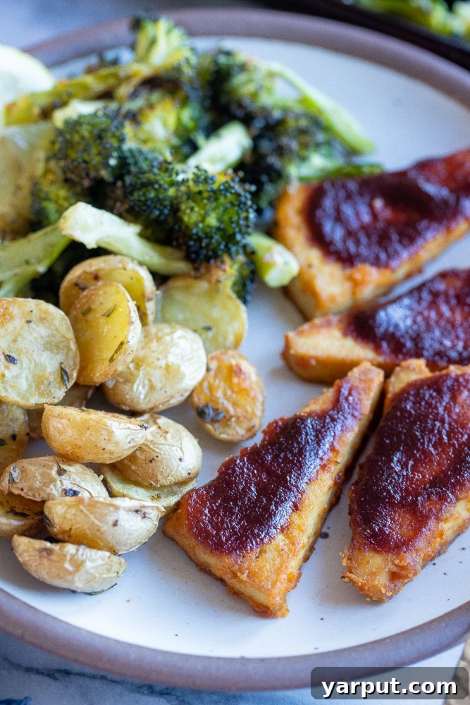One-Pan BBQ Tofu Power Plate 8 close up of baked BBQ Tofu, showing crispy texture and sauce