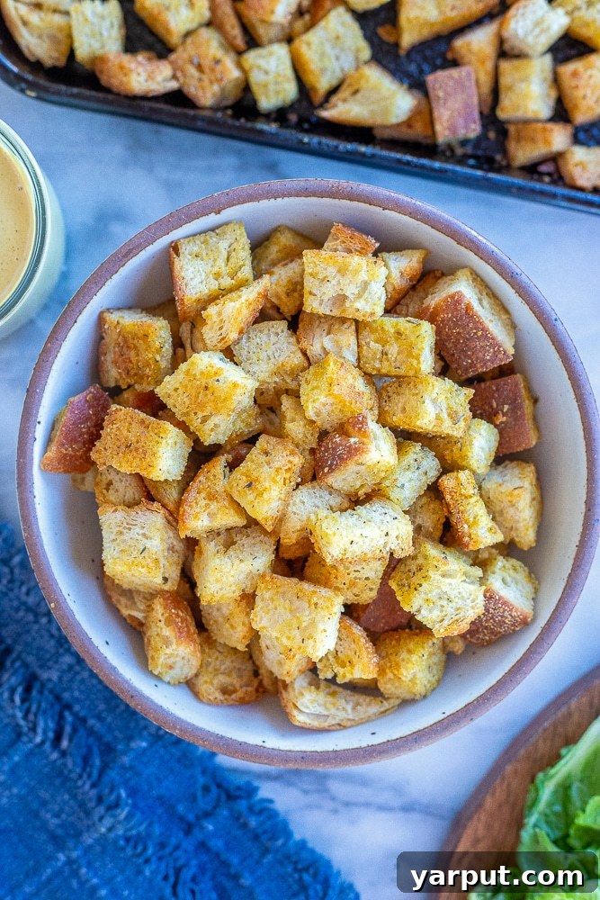 Golden Garlic Herb Croutons 2 A beautifully presented bowl of homemade croutons seasoned with garlic and herbs, ready to be enjoyed.