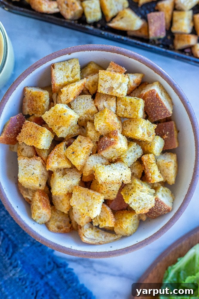 Golden Garlic Herb Croutons 7 A large, inviting bowl filled with easy homemade croutons, glistening and perfectly golden.