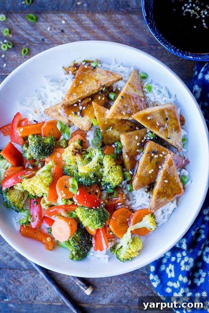 67 Beginner-Friendly Vegan Recipes 14 Wholesome and colorful tofu teriyaki bowls, featuring glazed tofu, fresh veggies, and rice, creating a balanced and flavorful meal.