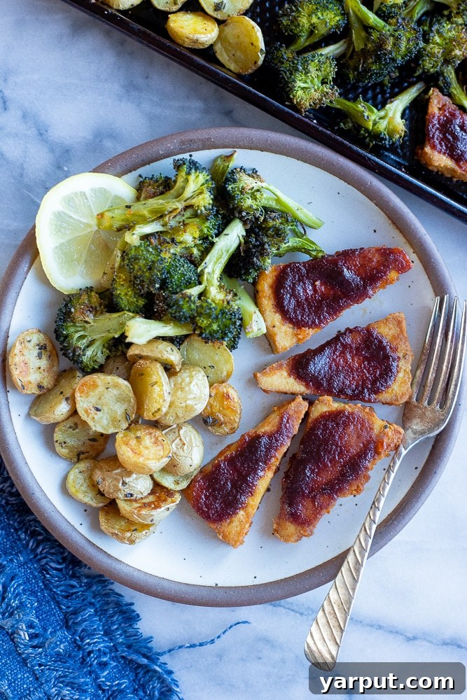 67 Beginner-Friendly Vegan Recipes 4 A vibrant sheet pan meal featuring smoky BBQ tofu, tender broccoli florets, and roasted golden potatoes, all cooked together for minimal cleanup.