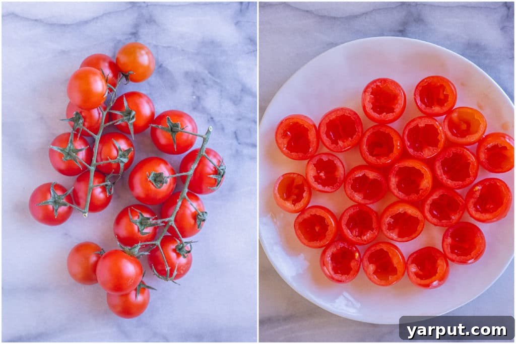 Zesty Guacamole Tomato Bites 4 Rows of scooped out cherry tomatoes, ready to be filled with delicious guacamole, showcasing the preparation step.