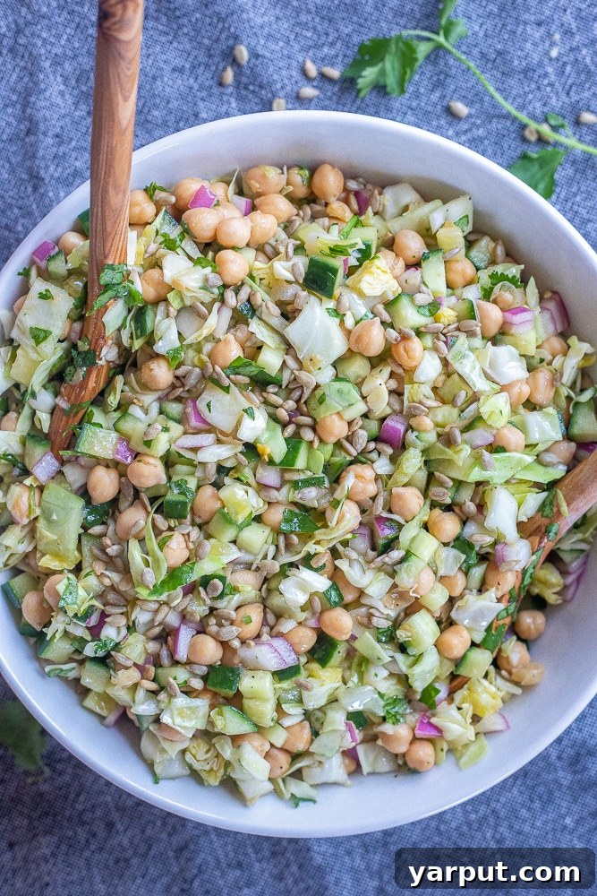 Vibrant Chickpea & Cabbage Medley with Cucumber 2 A large bowl of colorful chickpea salad with crisp cucumber and cabbage, ready to be enjoyed
