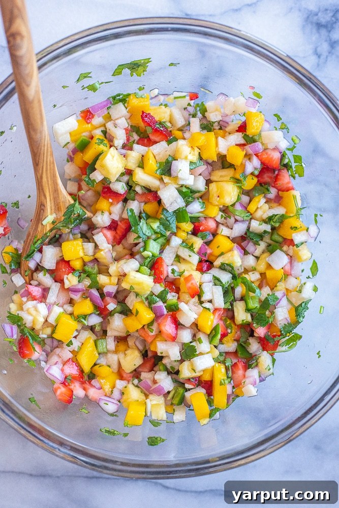 Luscious Fruit Salsa 4 fruit salsa mixed up in a bowl