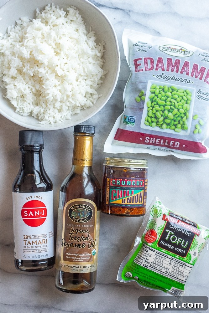 All the essential ingredients neatly laid out for preparing this delightful Spicy Edamame Stir Fry with Tofu recipe, highlighting freshness and simplicity.